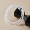 Detailed view of irregular square resin bangle with translucent white marble texture - Marble White (AB0086-1)