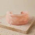 Macro detail of wide irregular peach resin cuff bracelet with wavy textured finish - Peach Pink Marble Texture (AB0085-3)
