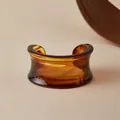 Detail of amber acrylic cuff bracelet with brown marble texture and open-end design - Amber Flow Pattern Style (AB0090-4)