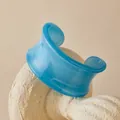 Macro detail of royal blue semi-transparent acrylic resin cuff bracelet on stone stand - Gem Blue Translucent Style (AB0090-7)