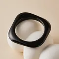Detailed close-up of a glossy black square resin bangle with marble texture details - Deep Black (AB0086-13)