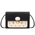 Bolso bandolera bicolor en negro y beige con sofisticados patrones florales láser - Negro