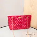 Vibrant red quilted shoulder bag with elegant gold chain strap and rotary lock - Red