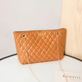 Caramel brown quilted tote bag with golden chain strap and turn-lock closure - Brown