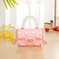 Pink mini jelly handbag with pearl handle, diamond quilt pattern and gold chain strap - Pink