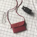 Red lychee texture mini crossbody bag with gold snap button and knot detail strap - Burgundy