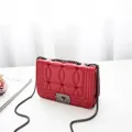 Red quilted leather square shoulder bag featuring heart embroidery and metal chain - Red