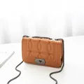 Brown quilted crossbody bag with circular stitching and dark metal chain strap - Orange