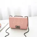 Chic pink quilted crossbody bag featuring heart-shaped stitching and a metal chain strap - Pink