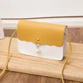 Minimalist crossbody bag with yellow and white color block and pearl pendant charm - Yellow