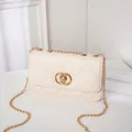 Elegant beige quilted chain bag with a gold double-ring lock and embroidery texture - White