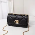 Classic black quilted crossbody bag with golden chain strap and double ring lock - Black