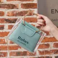 Transparent PVC box bag with golden cat ear handles and mint blue inner pouch insert - Blue