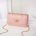 Pink quilted crossbody bag with gold chain strap and double ring buckle closure - Pink