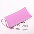 Purple faux leather clutch bag with crocodile texture and convenient wrist strap - Violet