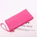 Rose pink crocodile embossed clutch bag with gold zipper and wrist strap detail - Rose Red