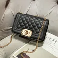 Classic black quilted shoulder bag with golden chain strap and vintage metal clasp - Black