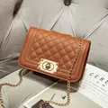 Brown quilted chain shoulder bag with gold-tone twist lock and faux leather finish - Brown