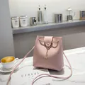 Pink PU leather bucket bag with gold deer pendant and drawstring closure - Pink