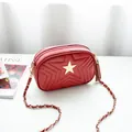 Red crossbody bag with star quilting, golden star pendant, and elegant fringe tassel detail - Red