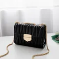 Elegant black quilted leather chain bag with matelassé texture and gold lock - Black (Light Gold Hardware)