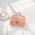 Pink faux crocodile leather crossbody bag with gold buckle and metal chain strap - Pink
