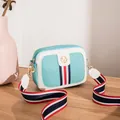 Mint green camera bag with pebble leather texture and colorful striped strap - Blue