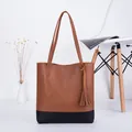 Women's tote bag in brown and black color block faux leather with stylish tassel detail - Brown