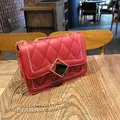 Elegant red quilted shoulder bag with gold chain strap and geometric metal buckle lock - Red