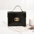 Elegant black lizard-pattern handbag with golden double-ring lock and chain strap - Black