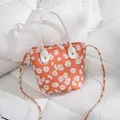 Mini sac seau orange vif à imprimé marguerites avec bandoulière réglable - Orange