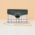 Green leather flap crossbody bag with orange plaid pattern and gold chain strap - Black