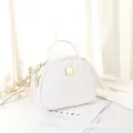 Elegant white quilted semi-circle handbag with golden hardware and adjustable strap - White