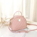 Pink semi-circle crossbody bag with quilted rhombic pattern and gold hardware - Pink