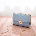 Light blue quilted mini crossbody bag with gold chain strap and metal turn-lock clasp - Blue