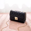 Classic black quilted crossbody bag with golden chain strap and twist-lock closure - Black