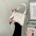 White crocodile-embossed mini handbag with stylish silk scarf and gold buckle - White