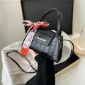 Elegant black crocodile pattern small square handbag with decorative silk scarf detail - Black