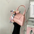 Pink faux leather shoulder bag with crocodile pattern and decorative silk scarf handle - Pink