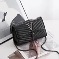 Elegant black quilted crossbody bag with metal V-letter logo and tassel chain strap - V-Pattern Black
