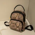 Mini backpack in light brown snakeskin pattern with gold metal logo and zipper detail - Snake Pattern Pink