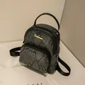 Mini backpack for women featuring grey snakeskin pattern and gold zipper detail - Snake Pattern Grey