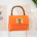Mini borsa jelly arancione motivo coccodrillo con manico in bambù e chiusura a scatto - Arancione