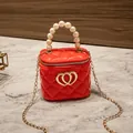 Mini red quilted jelly bag with pearl handle and golden chain strap for women - Red