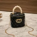 Quilted black mini jelly bag with pearl handle and golden double heart detail - Black