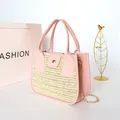 Pink woven patchwork crossbody bag with straw texture and elegant gold chain strap - Pink