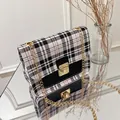 Plaid contrast color crossbody bag with gold chain and metal lock in black and white - Black