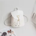 White quilted faux leather backpack with cat-ear buckle and pearl tassel charm - White