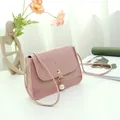 Light pink small square crossbody bag with crocodile texture and pearl pendant - Pink