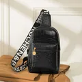 Women's black crocodile pattern chest bag with golden hardware and lettered strap - Crocodile Pattern Black
